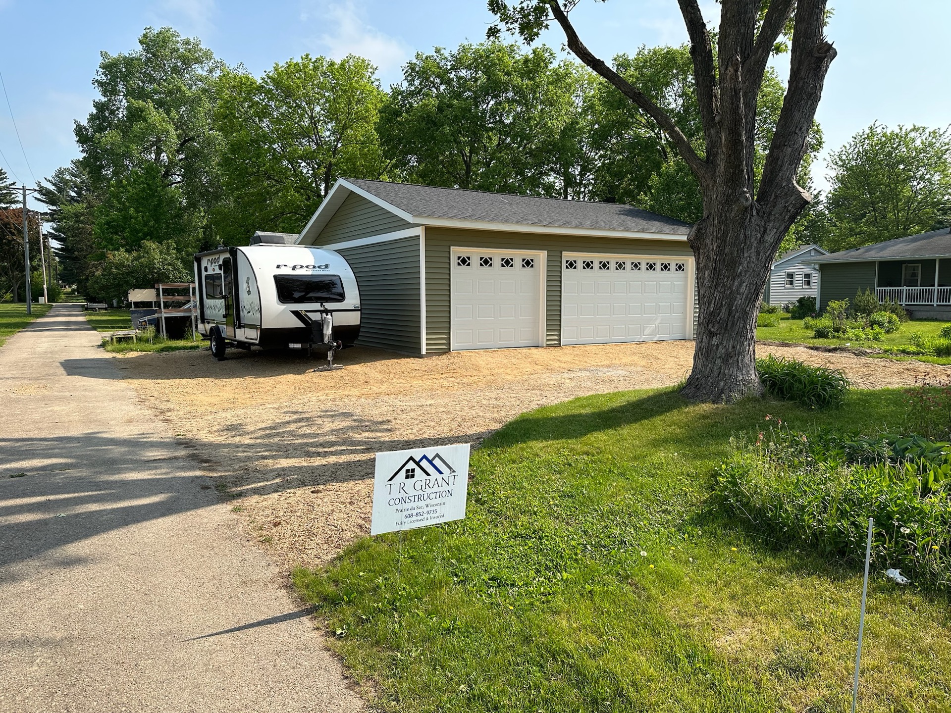 Completed detached garage — T.R. Grant Construction sign