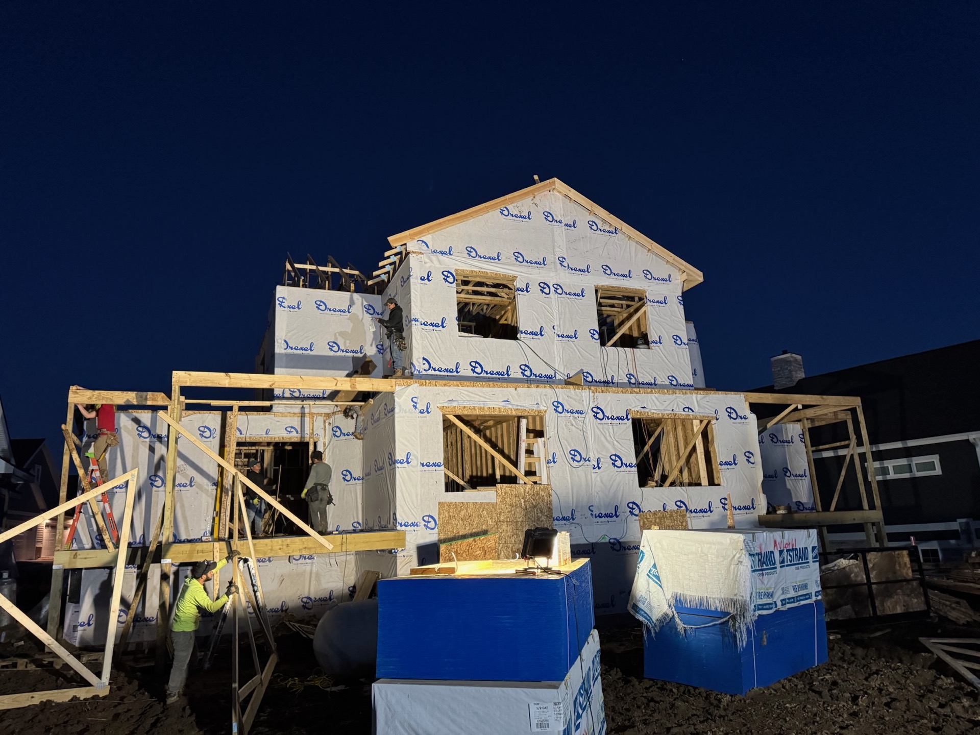T.R. Grant Construction crew working a night build on a luxury custom home