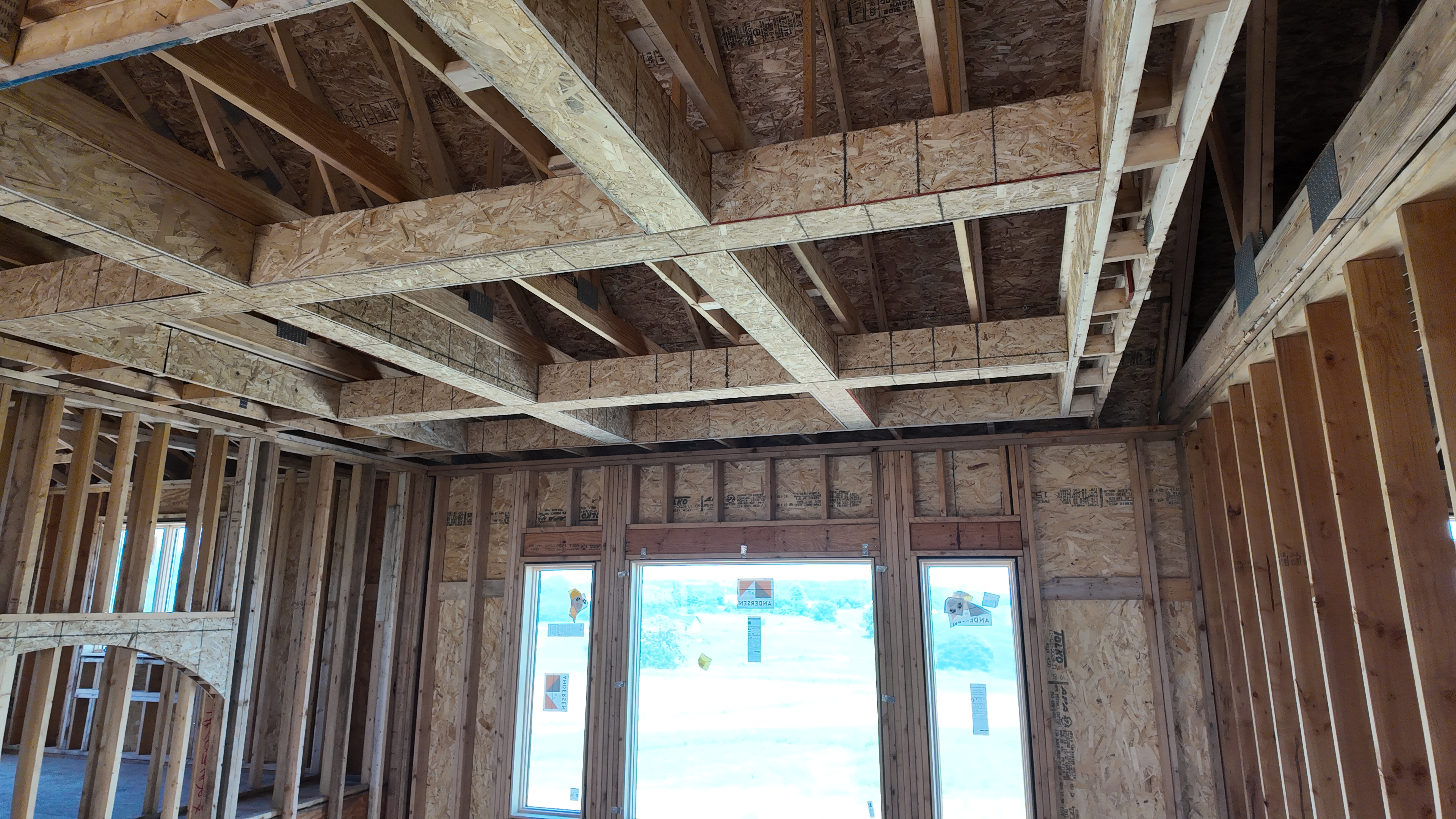 Exposed ceiling beam framing detail on luxury custom home