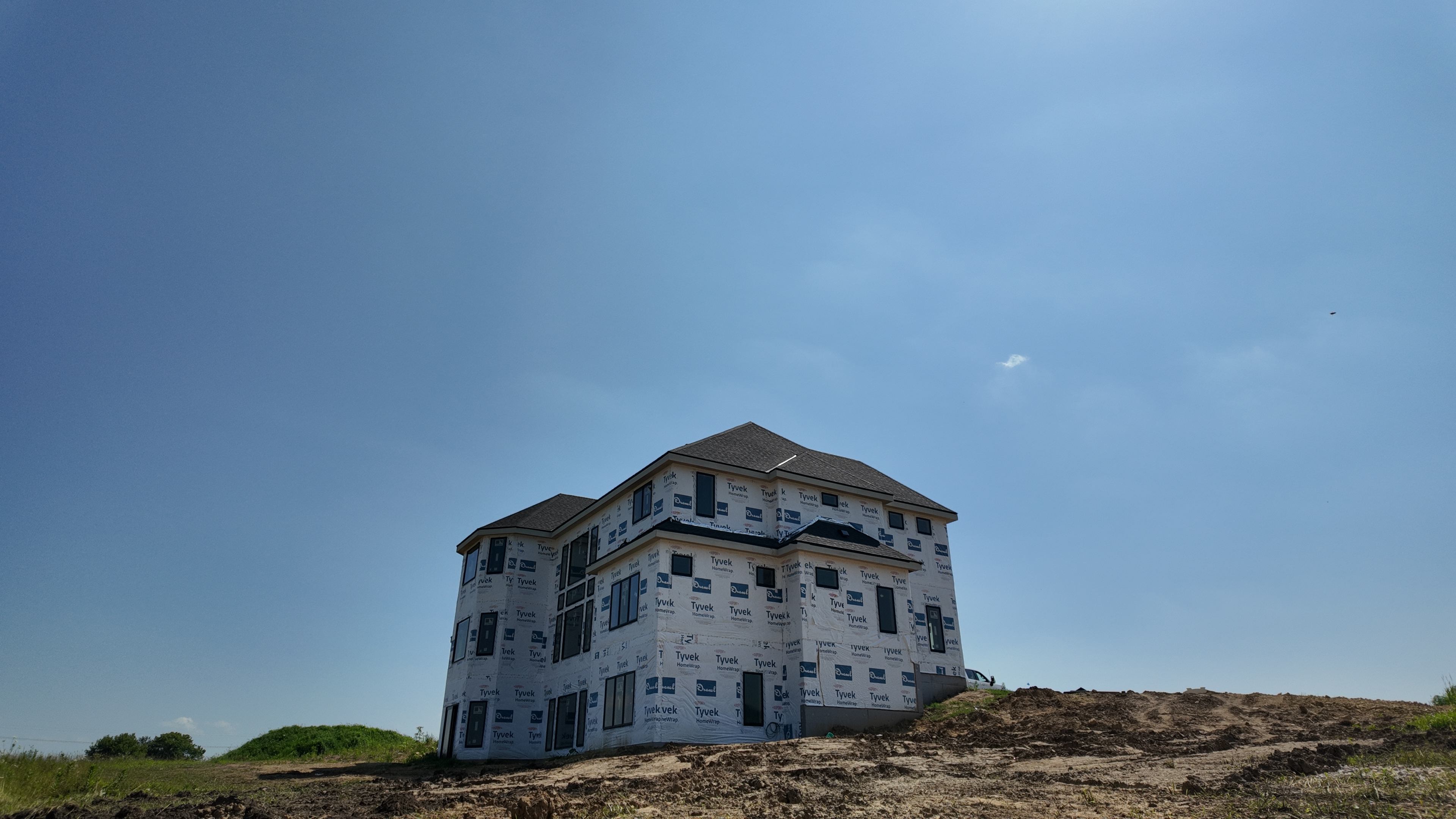 Large luxury custom home framed on a hilltop
